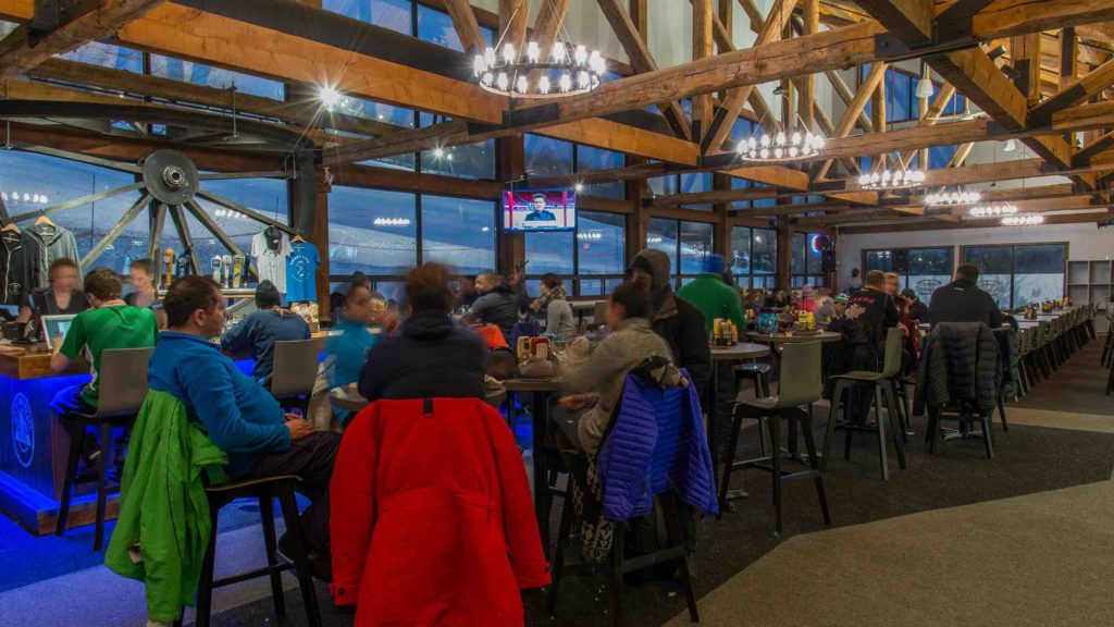 Dining with friends at the Bullwheel Pub is one of the best things to do in Blue Mountain Village in winter