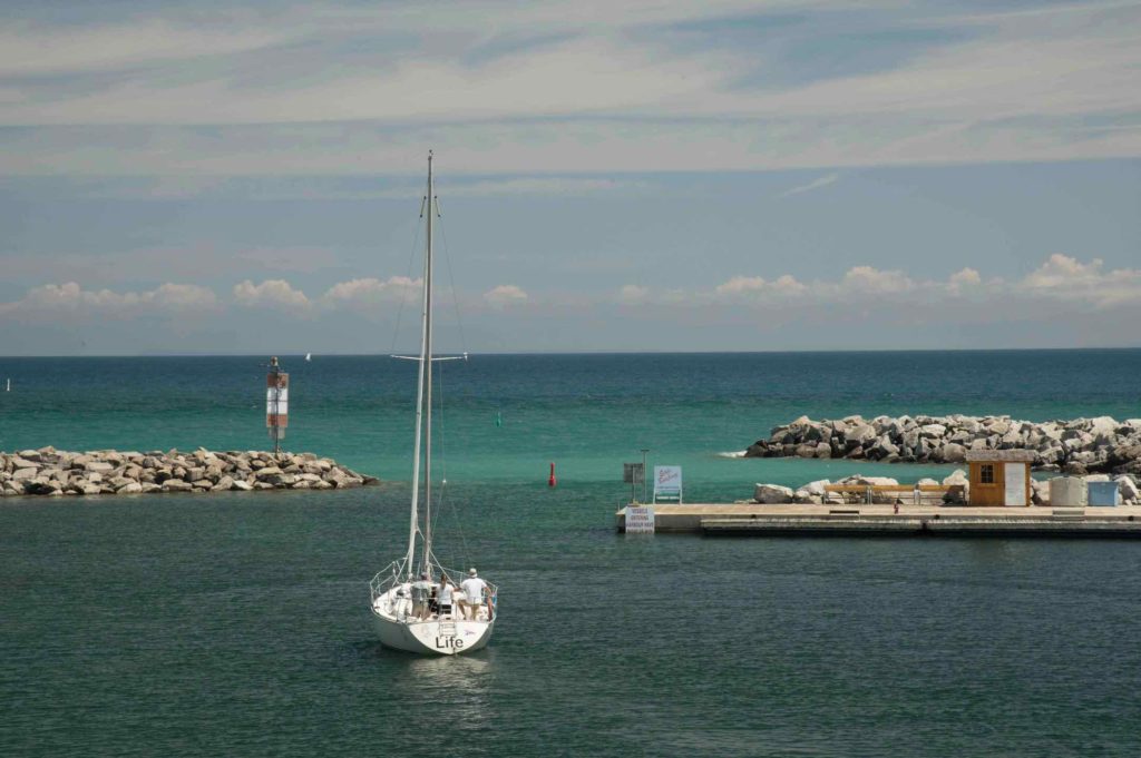 Sailing is one of the top things to do in Thornbury, as this picture shows a boat heading out to Georgian Bay