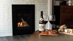 VanderMarck Boutique Hotel Collingwood fireplace with wine and cheese