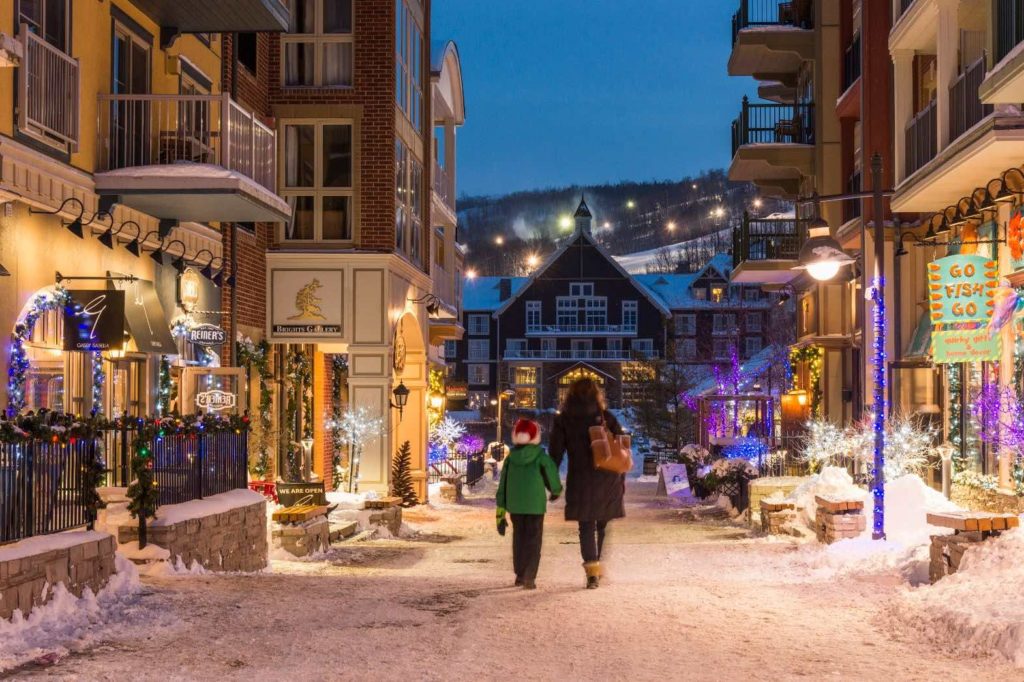 Things to do in Blue Mountain Village include walking its lanes in winter with your kids
