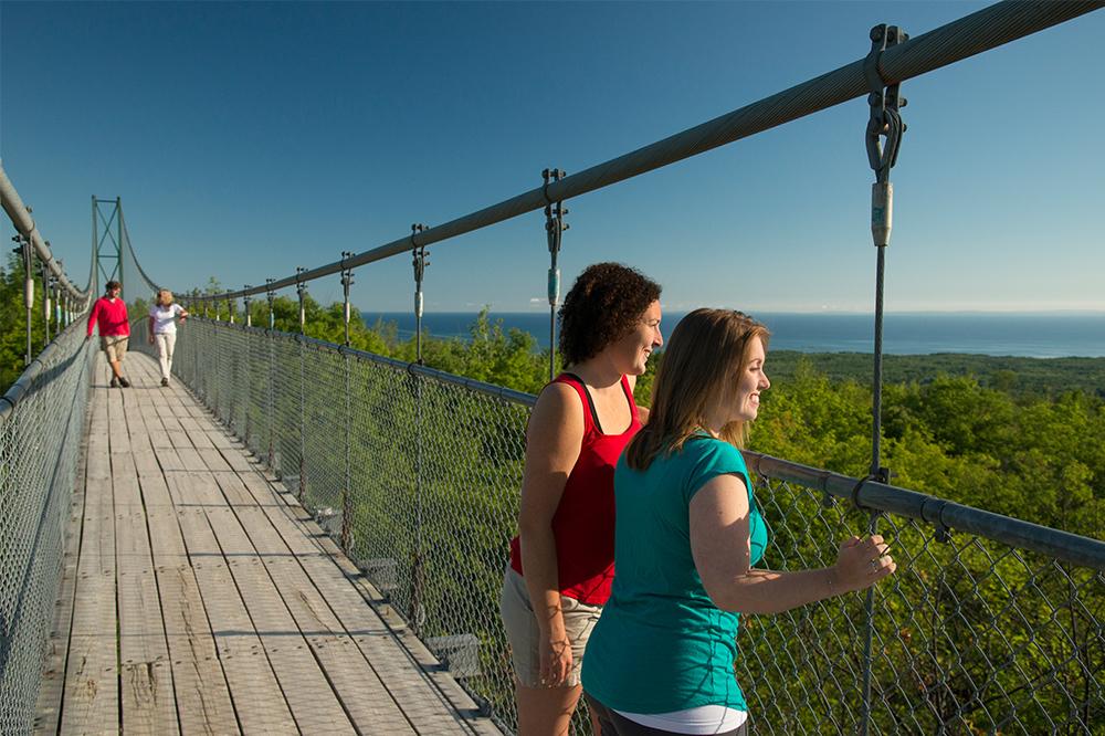 Women staning on the suspension bridge at Blue Mountains Scenic Caves