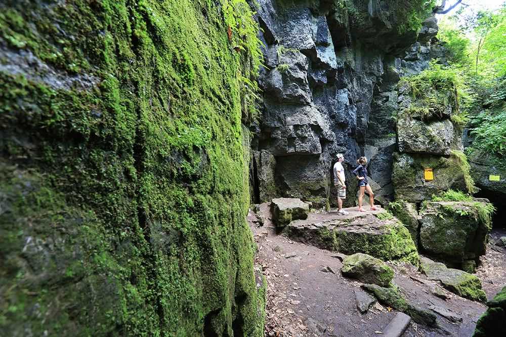 Couple shown exploring the Blue Mountains Scenic Caves in summer